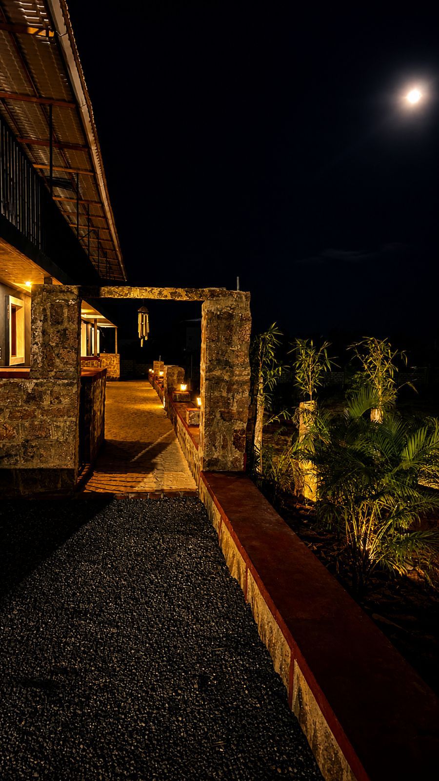 Resort facade at night with golden lighting