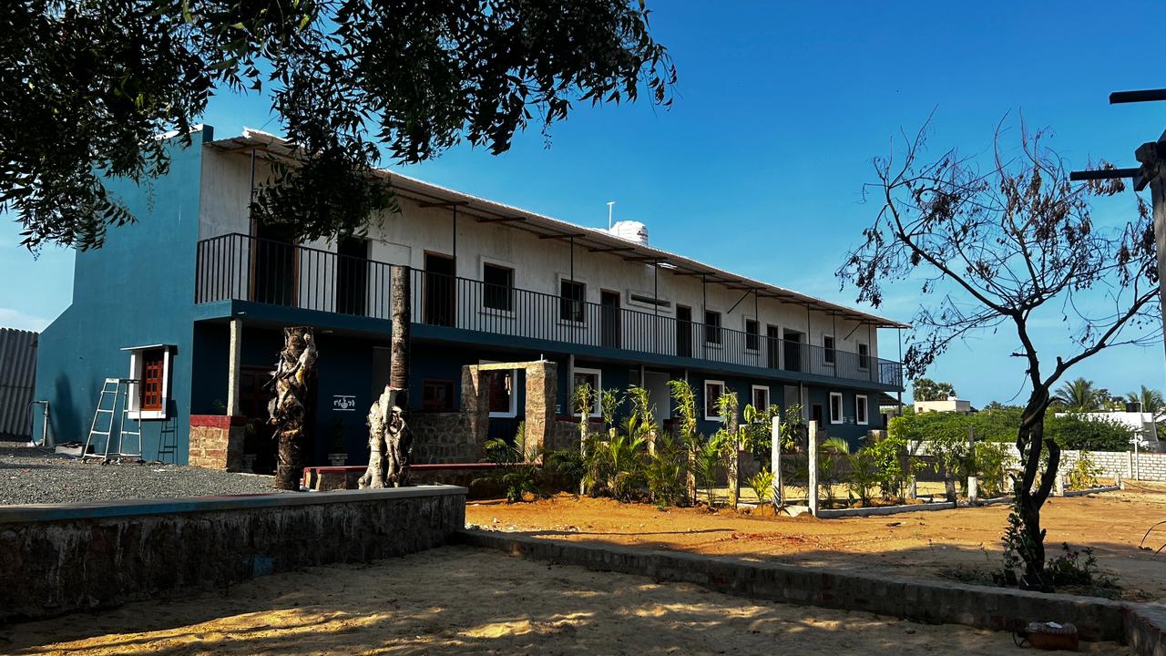 Garden and resort building under blue sky